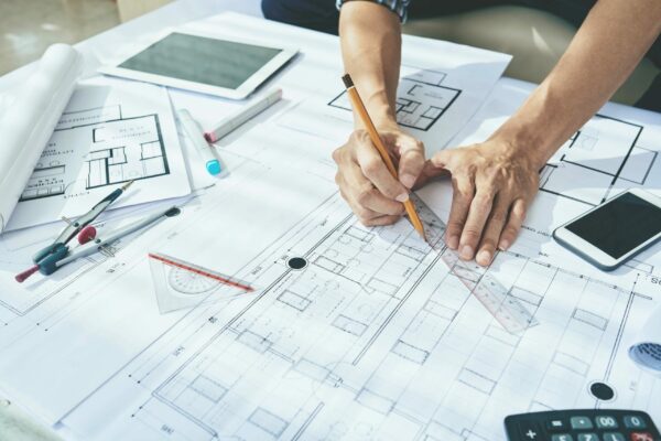 Close-up image of engineer drawing blueprint of building SSUCv3H4sIAAAAAAAEAJ2Sz24CIRDG7036DoazJLCwwPYpem88DDCrxFXMLto0xncv+0fFHntjft98AzPM9f1ttSIWhuDIx+o6RjkOXXceUg8pxGPGbL1w9CHFPkA3wpHdJoUMCdJ5wGEssSAHCbc5d4aL/37P1xyv7sIkZkeWCFkXbDjbid3Rbf1v53zY3FuBLR7dz/NtGfke4TCkcMDyiVngXL/U5oq9xA17XLN5cGLDdkjR7U+7mOKfii/2T4ynDp8l5sOtmG+PHcI836UKUcqxmqmGtiCQSitrarGtKYKyuuLaAK/Jo1nfCl6hp9Y6QaV2SAHQUa4apoSvLDbykdy6SnhklqKpgUrDW2qMtFSwmjcm51oup8fOvZL9d8L+UP79JXiMRQxnH2KxBpfooBsNoujx1AcXjtvCFtMO+3Kl8k7GQwGOMU0zWcZJfN65MeS5WSUkN0ZJUela8yUh+FF22klmuaPgmKGy0RW1bZuHaDIVjdAAIjd4+wUv5D78HAMAAA==